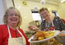 Christmas cracker: Volunteers Margaret Ansell and Jackie Warner help to serve up a festive treat for the Over-60s Club at Seacourt Hall