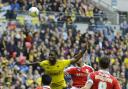 Chey Dunkley climbs above three Barnsley players during Oxford United's Johnstone's Paint Trophy final defeat Picture: David Fleming