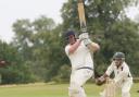 Challow & Childrey captain Ryan Gordon hammers a boundary in his 150 against Sandford St Martin Picture: Steve Wheeler