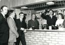 William Whitbread raises the first beer after opening Bicester's new Trophy Bar in December 1975