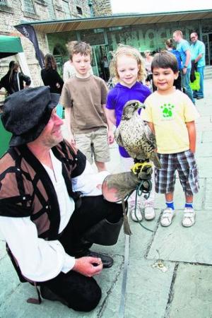 With Keith Jones and his falcon Storm are Lucien, eight, and Heloise Foltier, six, and Alex Subramanian, five