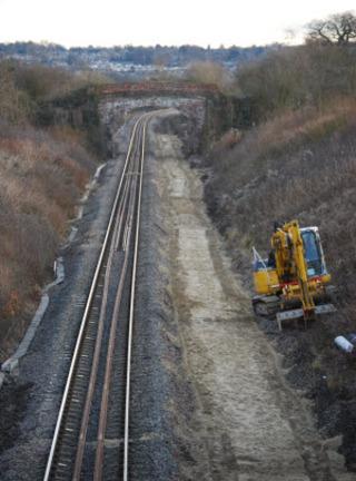 An excavator parked alongside the line near Shorthampton, west of Charlbury, on December 17, 2010, ahead of another night's work to clear old stone from the trackbed in West Oxfordshire