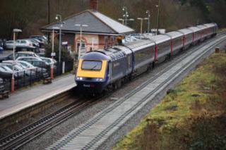 A First Great Western High Speed Train from London to Hereford arrives at Charlbury station on Wednesday, January 12, 2011, with sleepers for the second track laid alongside