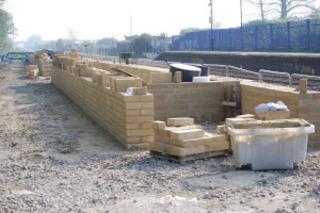 Walls for the new second platform at Ascott-under-Wychwood station take shape on April 20, 2011. The existing platform is to be extended to allow three-coach Turbo trains to stop.
