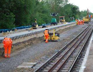 Preparing to lay new track through Ascott-under-Wychwood station on Monday, May 30, 2011