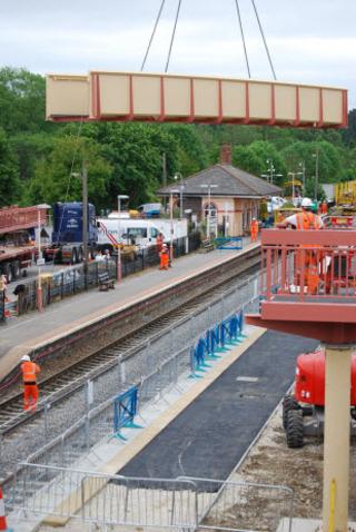 The main span of the new footbridge at Charlbury station is lifted into position over the tracks on Sunday, May 29, 2011. 