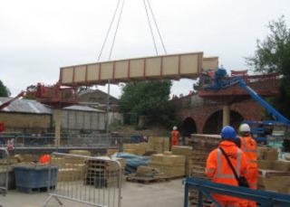 The main span of the new footbridge at Charlbury station is lifted into place on Sunday, May 29, 2011.