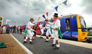 Charlbury morris men celebrate the redoubling project on the new platform at the town's station on Friday, June 10, 2011