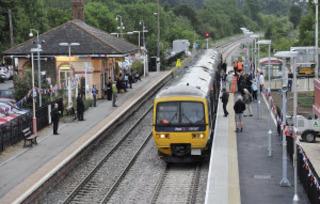 Passengers board the first train to call at Charlbury station's new platform on Monday, June 6, 2011