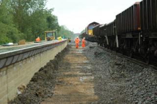 Preparing to lay new track through Ascott-under-Wychwood station