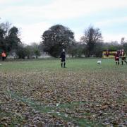 Martin Williams scores Watlington’s late winner from the spot – beating both the mass of leaves and Drayton’s goalkeeper