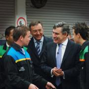 Gordon Brown is being presented with a Mini pedal car for his son, made by apprentices. Pic by Jon Lewis