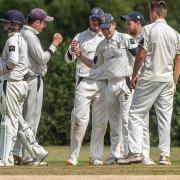 Adam Stapleford-Jones is congratulated after taking a catch for Bicester & North Oxford      Pictures: Richard Cave