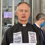 Tim Hewes Oxfordshire Vicar, sews lips shut in protest against Rupert Murdoch