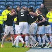 James Henry is mobbed by his Oxford United teammates after his last-ditch winner at Sheffield Wednesday Picture: Richard Parkes