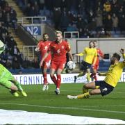 Matty Taylor slides in to score Oxford United's second goal against Wigan Athletic Picture: David Fleming