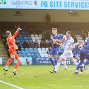 Matty Taylor heads home Oxford United's third goal at Gillingham Picture: Steve Edmunds