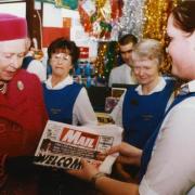 Queen Elizabeth II visits D&J Bromilow Newsagents in Berinsfield to pick up a copy of the Oxford Mail in 1997.