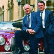 John Thaw and Kevin Whately  (and that famous red Jag) in an early episode of Inspector Morse.