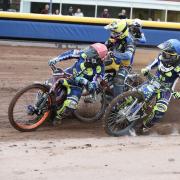 Scott Nicholls (left) leads the way in the first heat, as Alfie Bowtell (centre) crashed out Picture: Steve Edmunds