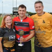 Brenda Cyster presents the Lauren Cyster Megabowl Trophy to Blackheath 2nd captain Lewis Hollidge, alongside Chinnor’s Jon Lavin, who organised the event Picture: Chinnor RFC Thame