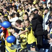 Oxford United supporters celebrate at the Kassam Stadium. Picture: David Fleming