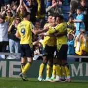 Oxford United celebrate their fifth goal against Peterborough United