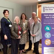 Victoria Prentis (centre) with the team at at Reducing the Risk of Domestic Abuse
