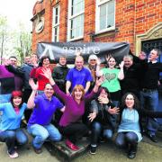 Aspire chief executive, front centre, celebrates the nomination with staff