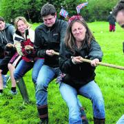 Sarah Martin, front, leads her tug of war team at Aristotle Lane   Picture: OX52206 Ric Mellis