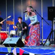 Lucy Cropper of lucysamanddan sings for the crowd on The Leys in Witney