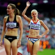 Hannah England salutes the fans after reaching the 1,500m semi-final
