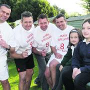 James Maskell, Ali McKnight, Jason Robb and John Boal are running the Oxford Half Marathon in memory of their friend Mark Williams. Also pictured are Mark’s daughters, Tilly, five, and Ellie, 11
