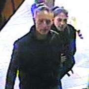 CCTV of two people wanted over the theft of a DVD