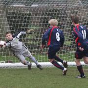 Abingdon goalkeeper Alfie Kingsbury manages to keep out this effort from Marston’s Rowan Alexander