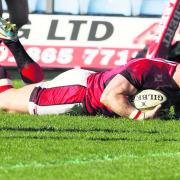 Skipper Tom May dives in for London Welsh's third try