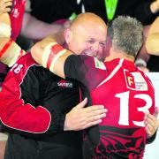 London Welsh skipper Tom May hugs head coach Justin Burnell after their success at Bristol on Wednesday night which secured promotion back into the Aviva Premiership