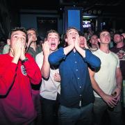Fans watching the match at Wahoo show their disbelief after England’s defeat. Pictures: OX67975 Andrew Walmsley