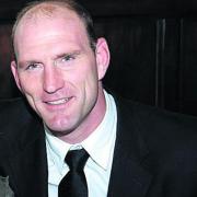 Rugby player Lawrence Dallaglio has joined the fight to provide better NHS treatment for cancer sufferers