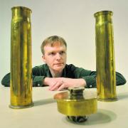 Dale Johnston with First World War shell casings