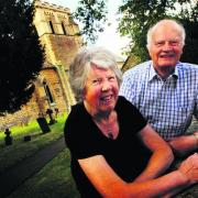 Ron and Diana Cosford outside St Mary's Church in Iffley