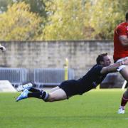 London Welsh’s Seb Stegmann is held up by this full-stretch tackle from Mike Blair