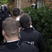 Going in: Police raid the brothel in Middle Way, Summertown, in November 2007