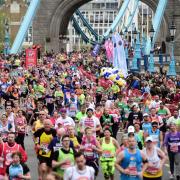 Challenge: London Marathon runners make their way over Tower Bridge during this year’s event