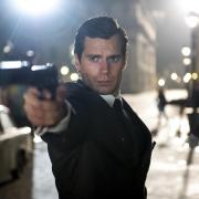 Henry Cavill stars as Napoleon Solo in Guy Ritchie’s good-looking but disappointing version of The Man From U.N.C.L.E.