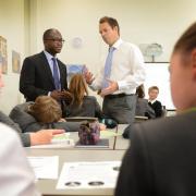 Concerns: Education and childcare minister Sam Gyimah with teacher David Jardine in a humanities class at Heyford Park Free School earlier this month