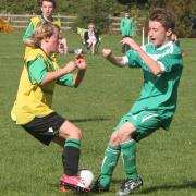 Kidlington's Josh Pipkin and Thomas Farrell go for the ball in their Under 14 C League contest