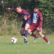Marston Saints’ Dylan Thagie holds Quarry Rovers’ Umair Yousef at bay during the 1-1 draw at Marston in the Under 15 C League           Picture: Steve Wheeler