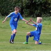 Abingdon’s Dillan Grice (left) celebrates with teammate Ben Lisemore after scoring the first of his two goals in the Under 12 victory over Bardwell