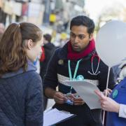 Call for support: Junior doctor Karthick Darma speaks to shoppers about planned industrial action and reasons for striking in Oxford last month